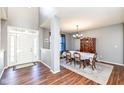 Elegant dining room with wood floors, white walls, and a classic chandelier at 15898 Bounds Dr, Noblesville, IN 46062