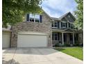 Beautiful two-story home with stone accents, a covered porch, and a spacious attached two car garage at 15898 Bounds Dr, Noblesville, IN 46062