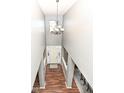 Bright foyer with hardwood floors, chandelier, and a clear view of the front door at 15898 Bounds Dr, Noblesville, IN 46062
