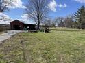 Large open outbuilding and well-maintained grassy acreage on this beautiful property at 17245 N 200 E, Summitville, IN 46070
