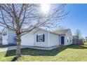 Cozy single-story home with a well-maintained lawn and blue shutters on the window at 1850 Blue Pine Ln, Indianapolis, IN 46231