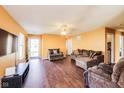 Spacious living room with hardwood floors, ample seating, and natural light at 1850 Blue Pine Ln, Indianapolis, IN 46231
