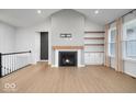 Inviting living room featuring a fireplace and large windows, perfect for relaxation and entertainment at 19036 Karyn Ln, Noblesville, IN 46062