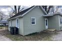 Picture of the side and back of a light green, single-story home with a small porch at 1904 S Rosemont Ave, Muncie, IN 47302