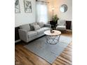 Cozy living room featuring modern furnishings, stylish decor, and hardwood floors at 1940 N Drexel Ave, Indianapolis, IN 46218
