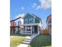 Charming two-story home with a covered porch and a well-maintained lawn, perfect for Gathering living at 1945 Carrollton Ave, Indianapolis, IN 46202