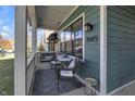 Inviting front porch with seating area, perfect for relaxing and enjoying the outdoors at 1945 Carrollton Ave, Indianapolis, IN 46202