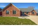 Attractive brick home with manicured front lawn and concrete driveway, perfect for curb appeal at 2054 Partridge Dr, Franklin, IN 46131