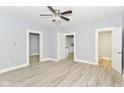 Inviting living room with hardwood floors, ceiling fan, and neutral paint at 209 Pennsylvania St, Shirley, IN 47384