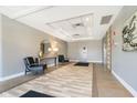 Inviting lobby featuring stylish seating, decor, and well-maintained tile flooring at 20971 Shoreline Ct # 309, Noblesville, IN 46062