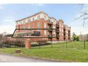 This condo building features multiple balconies and a secure fenced lawn area for residents to enjoy at 20971 Shoreline Ct # Apt 212, Noblesville, IN 46062