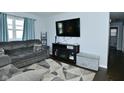 Cozy living room featuring comfortable seating, large TV, and stylish decor at 3618 Spann Ave, Indianapolis, IN 46203
