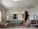 Bright living room features vaulted ceilings, comfortable seating, and natural light at 3760 Briar Hill Way, Columbus, IN 47203