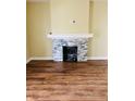Cozy living room with a charming stone fireplace and pristine hardwood floors at 426 Eastern Ave, Indianapolis, IN 46201