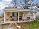 Inviting covered front porch with seating and decorative accents, creating a cozy outdoor space at 509 W Pierson St, Greenfield, IN 46140