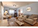 Spacious living room with wood floors, comfortable seating, and plenty of natural light at 509 W Pierson St, Greenfield, IN 46140