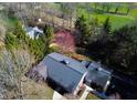Aerial view showing the house surrounded by trees and greenery, emphasizing privacy at 625 Mulberry St, Zionsville, IN 46077