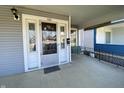 Inviting front porch with a swing, decorative door with glass, and room to relax at 925 E Main St, Muncie, IN 47305