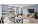 Bright living room with large windows, stylish furniture, and modern decor at 10432 Dark Star Dr, Indianapolis, IN 46234