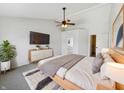 Cozy main bedroom with a ceiling fan, accent wall, and en-suite bathroom access at 11063 Deer Valley Dr, Indianapolis, IN 46229