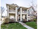 Charming two-story home features a classic design with inviting balconies and a well-manicured front lawn at 1727 N New Jersey St # A, Indianapolis, IN 46202