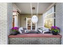 Inviting porch features comfortable seating, stylish decor, and a relaxing atmosphere at 1727 N New Jersey St # A, Indianapolis, IN 46202