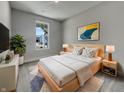 Well-lit bedroom with a large window, soft carpet, and tasteful decor creating a cozy retreat at 17877 Haralson Row, Westfield, IN 46074