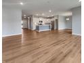 Expansive living area featuring modern finishes and an open layout, seamlessly connecting living and dining spaces at 17877 Haralson Row, Westfield, IN 46074