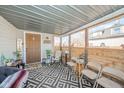 Cozy covered porch featuring a geometric rug, comfortable seating, and a welcoming atmosphere at 1815 Pearl St, Anderson, IN 46016