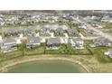 Sprawling community with many homes surrounding serene lakes and green spaces at 18271 Lake Winds Dr, Westfield, IN 46074