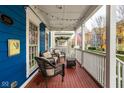 Relaxing front porch view with wicker furniture and overhead string lights creating a cozy outdoor ambiance at 2067 Rhettsbury St, Carmel, IN 46032