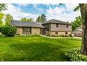 Charming home with manicured lawn, stone accents, and gray siding, offering great curb appeal at 224 Brierley Way, Carmel, IN 46032