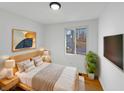 Cozy bedroom with a comfortable bed, stylish lamps, and a window with a view at 2928 Sheffield Dr, Indianapolis, IN 46229