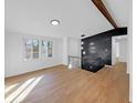 Bright living room featuring hardwood floors, an open staircase, and natural light at 2928 Sheffield Dr, Indianapolis, IN 46229