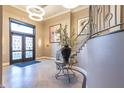 Lobby entrance with a glass door, staircase, modern lighting, and a decorative flower display at 355 E Ohio St # 221, Indianapolis, IN 46204