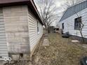Exterior view of the house showing the space between the house and the siding at 3812 S Ebright St, Muncie, IN 47302
