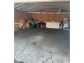 A large empty garage with a cracked concrete floor offers lots of storage space at 3817 N Sheridan Ave, Indianapolis, IN 46226