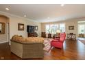 Open living space with hardwood floors, neutral walls, and ample natural light at 3941 Stratfield Way, Westfield, IN 46074