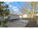 View of backyard, showcasing the detached garage and ample space for outdoor activities at 3960 N Park Ave, Indianapolis, IN 46205
