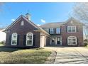 Charming two-story home with a two-car garage, brick accents, and a landscaped front yard at 6191 E Ayrshire Cir, Camby, IN 46113