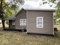 The exterior of this home has a neutral siding, complementing the surrounding landscape at 709 S Vine St, Muncie, IN 47302