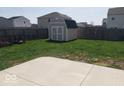 Large backyard featuring a storage shed and ample green space, ideal for outdoor activities at 7835 E 296Th St, Atlanta, IN 46031
