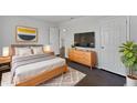 Cozy bedroom featuring a comfortable bed, stylish decor, and a mounted TV at 851 Pine Lake Dr, Greenwood, IN 46143