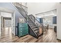 Grand foyer with staircase, hardwood floors, and an adjacent dining room at 11789 Langham Crescent Ct, Fishers, IN 46037