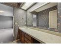 Bathroom featuring floral wallpaper, vanity with sink and mirror, and neutral carpet at 138 President W Trl, Indianapolis, IN 46229