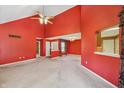 Spacious living room featuring high ceilings, a ceiling fan and neutral carpet at 138 President W Trl, Indianapolis, IN 46229