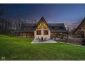 Exterior featuring a covered patio and seating area in the backyard at 222 Stony Ln, Noblesville, IN 46060