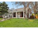 Exterior view of home with a front yard and covered front porch with columns at 304 W 43Rd St, Indianapolis, IN 46208