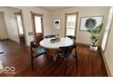Inviting dining space features modern decor, a round table, and warm, wood-look flooring at 325 E 10Th St, Indianapolis, IN 46202