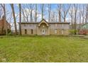 Charming home featuring a stone and siding facade with a well-manicured lawn at 4140 Melbourne Rd, Indianapolis, IN 46228